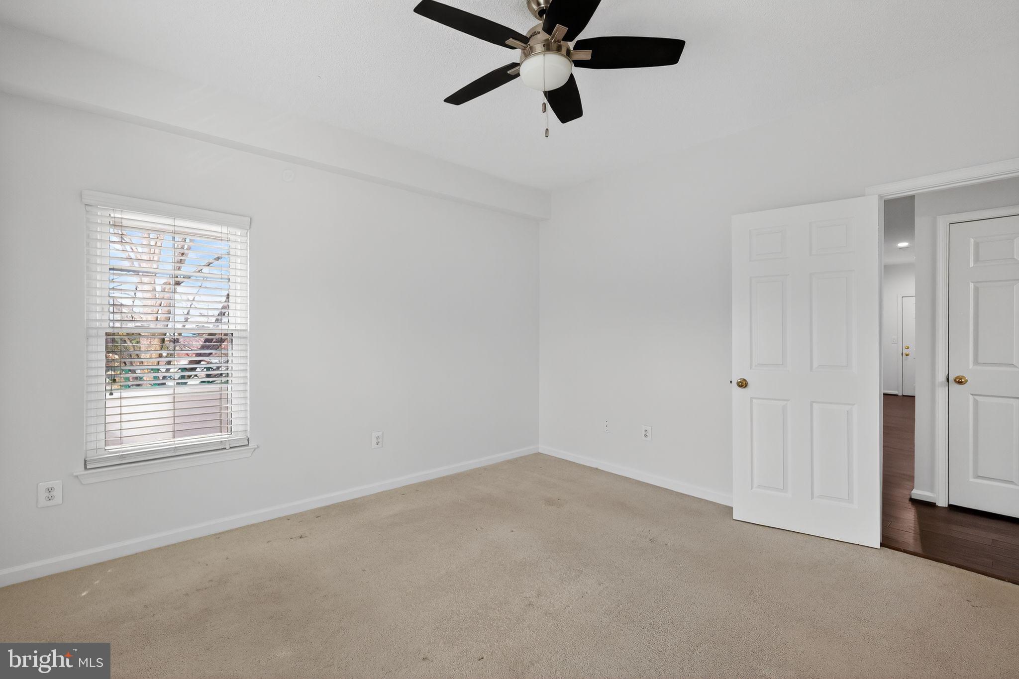12016 Taliesin Place, Unit 26 Reston, VA 20190 - Photo 16 of 30 a view of an empty room with a window