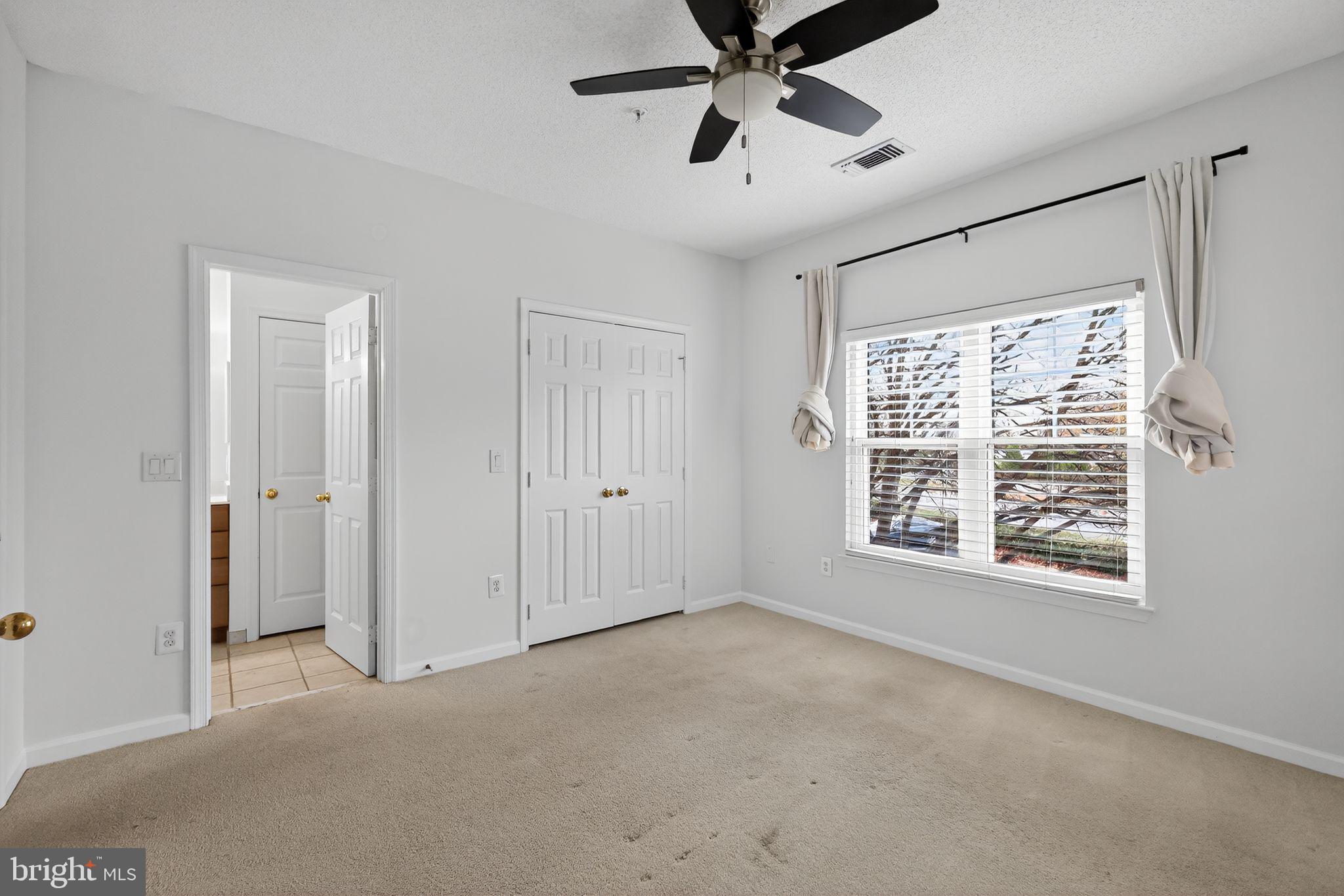 12016 Taliesin Place, Unit 26 Reston, VA 20190 - Photo 18 of 30 a view of an empty room with a window