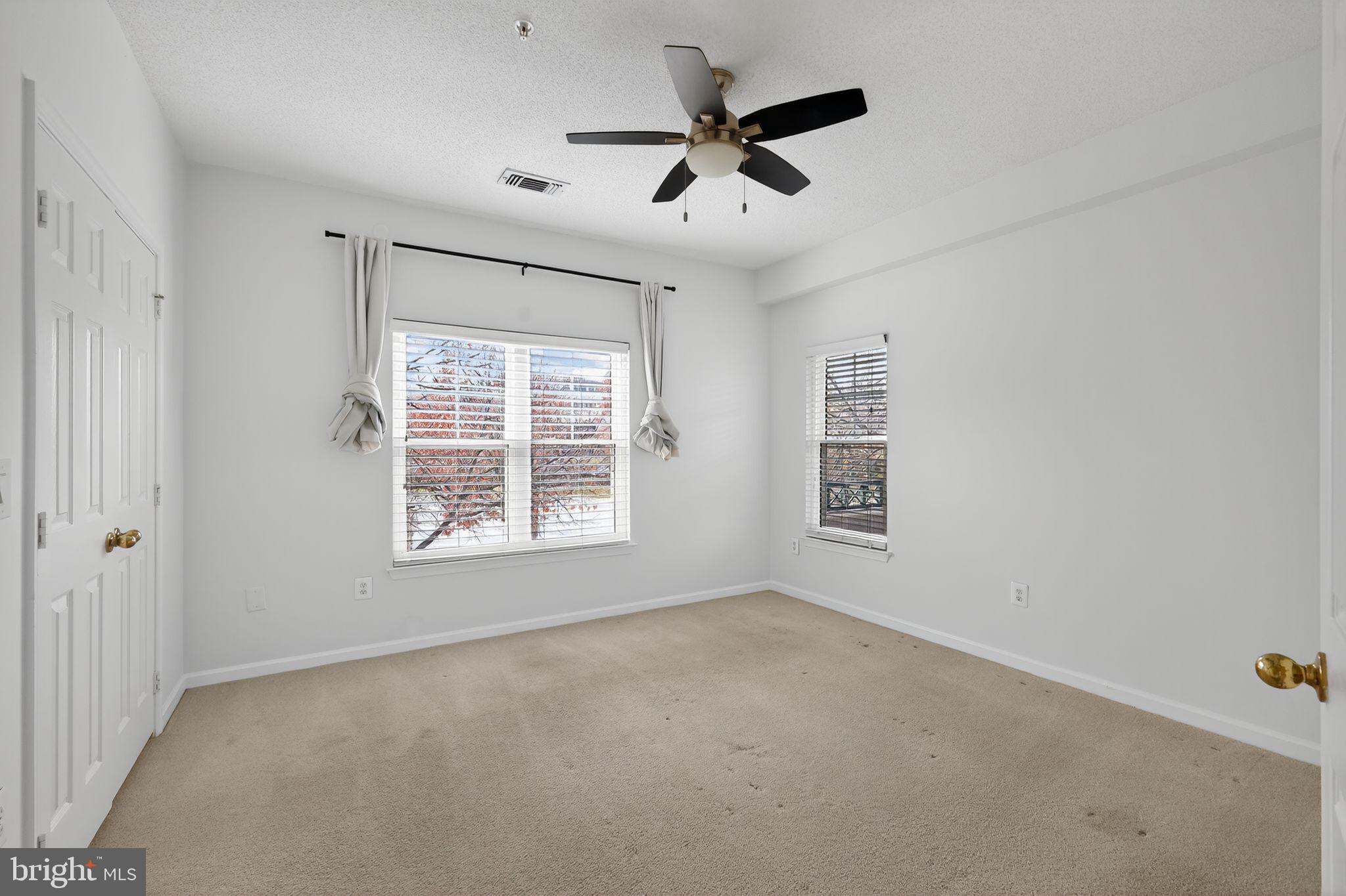 12016 Taliesin Place, Unit 26 Reston, VA 20190 - Photo 22 of 30 a view of an empty room with a window