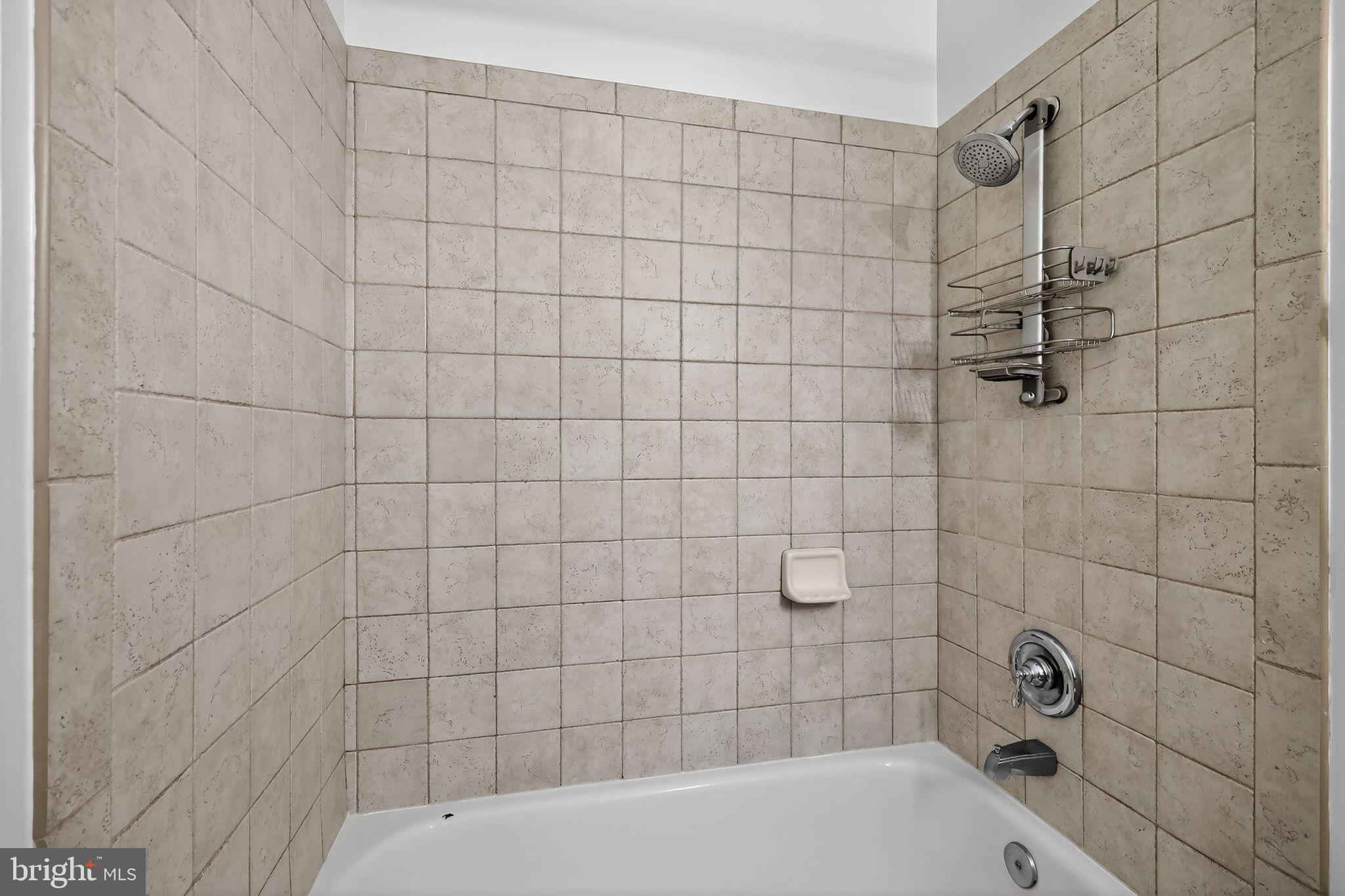 12016 Taliesin Place, Unit 26 Reston, VA 20190 - Photo 27 of 30 a bathroom with a bathtub