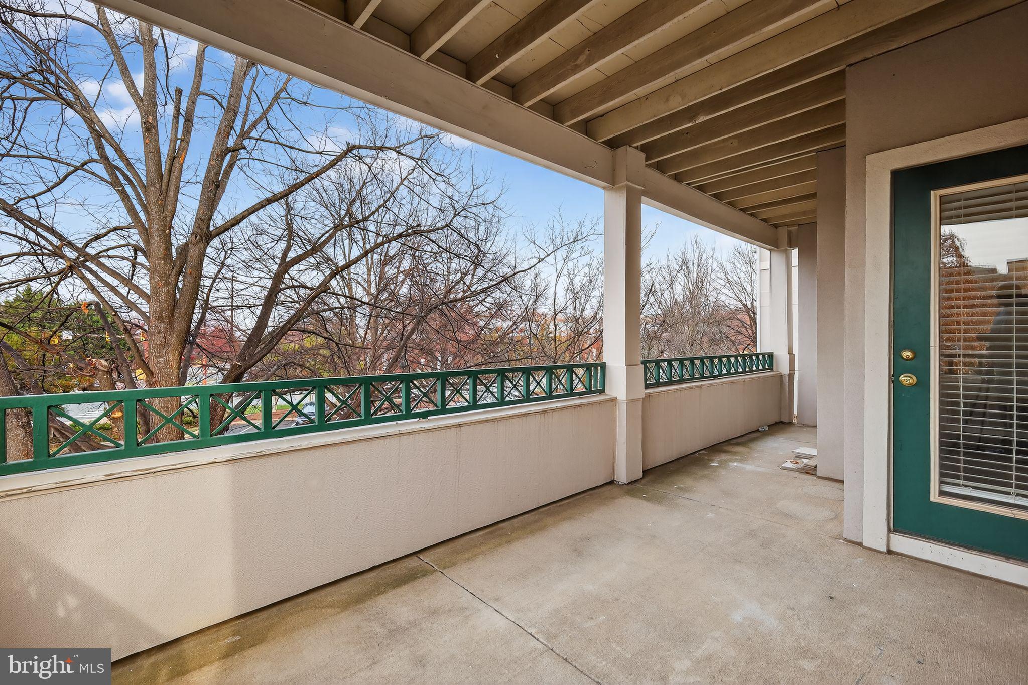 12016 Taliesin Place, Unit 26 Reston, VA 20190 - Photo 29 of 30 a view of a building from a balcony