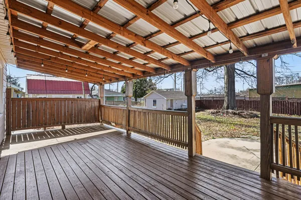 a view of a porch with wooden floor