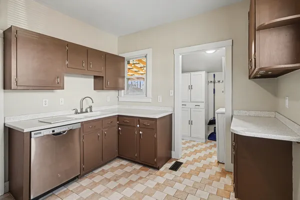 a kitchen with a sink stove and refrigerator