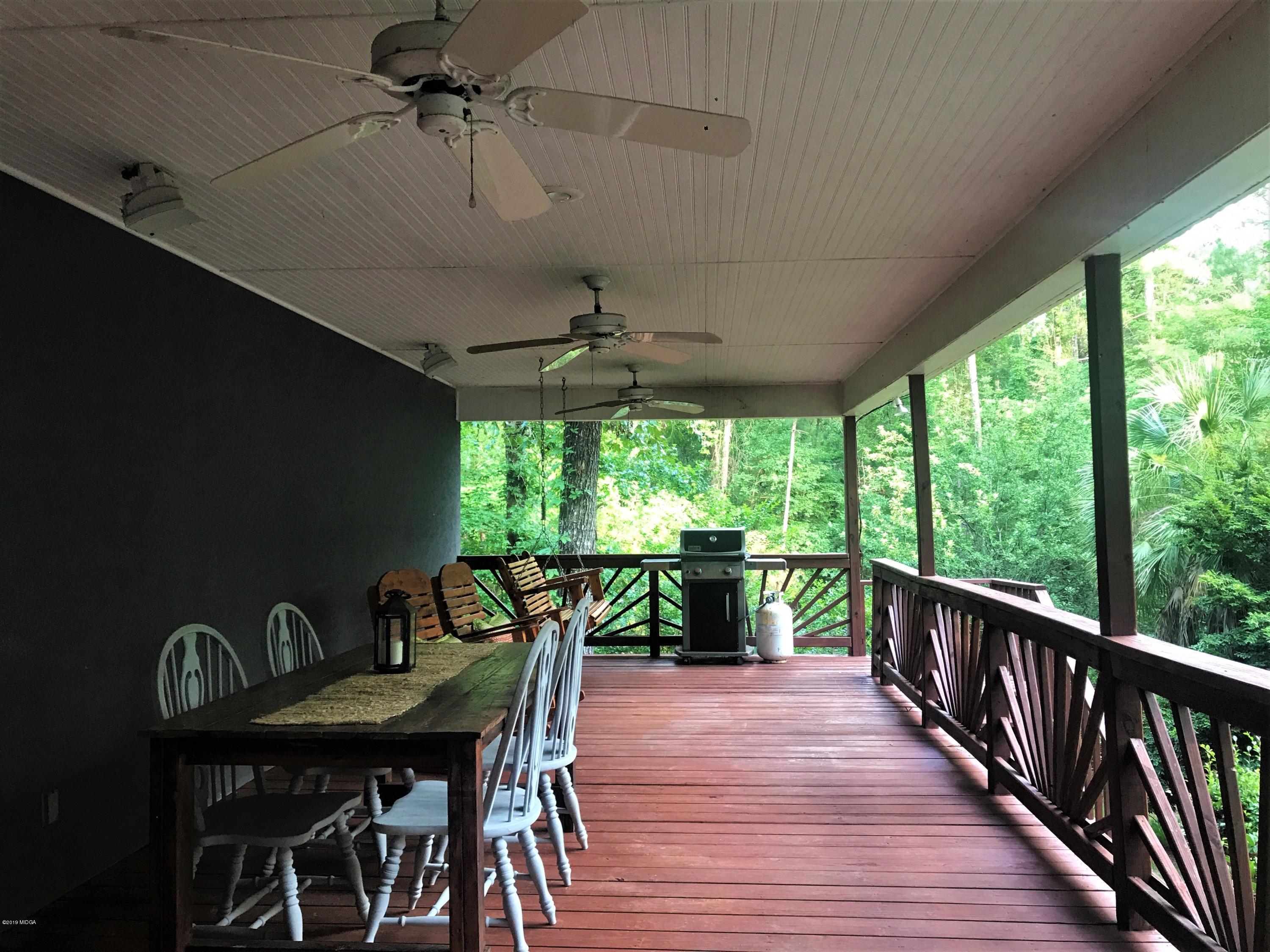 1569 Johnson Road Macon, GA 31220 - Photo 16 of 28 a view of a porch with furniture and a yard