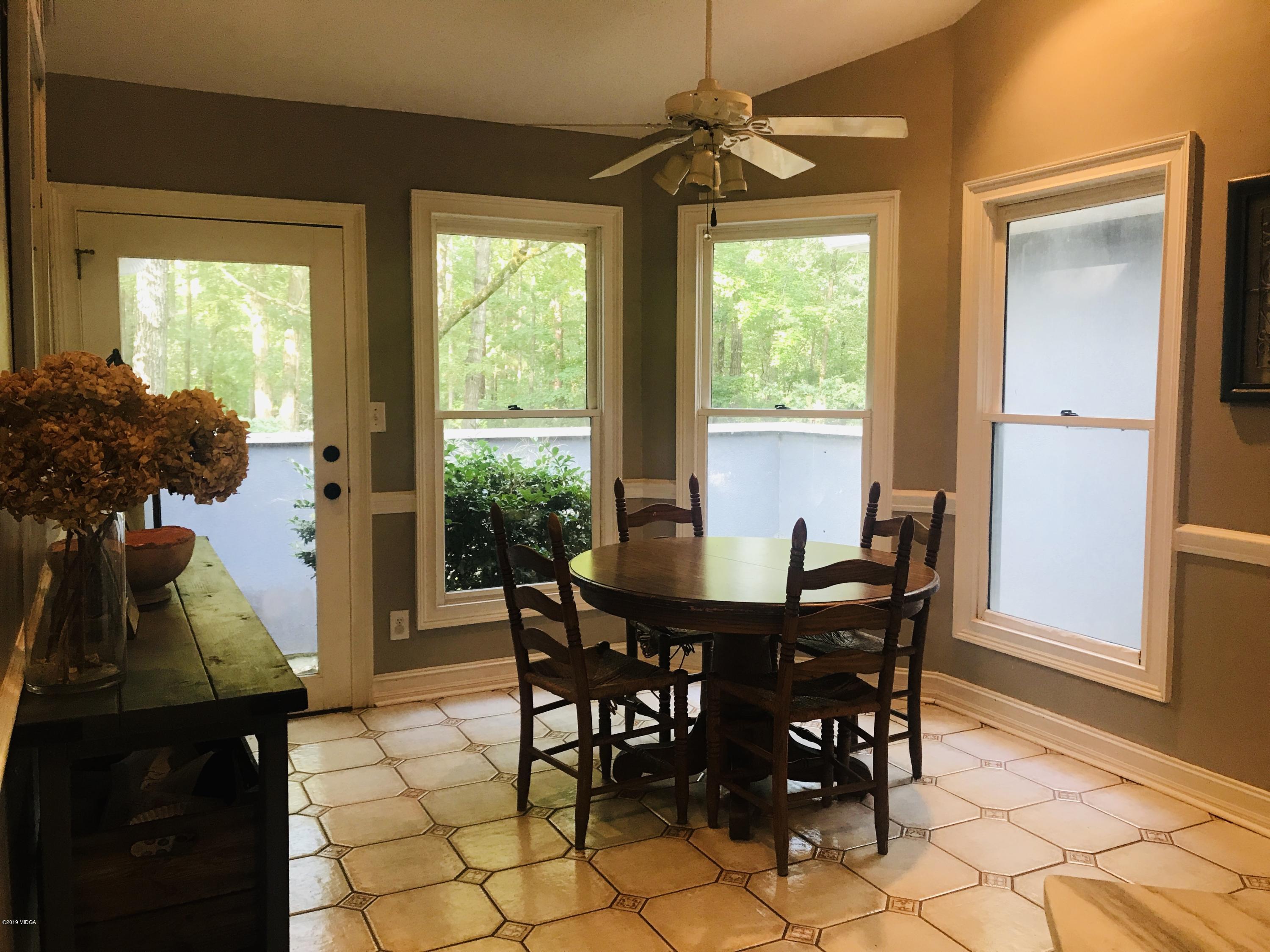 1569 Johnson Road Macon, GA 31220 - Photo 23 of 28 a view of a dining room with furniture window and outside view