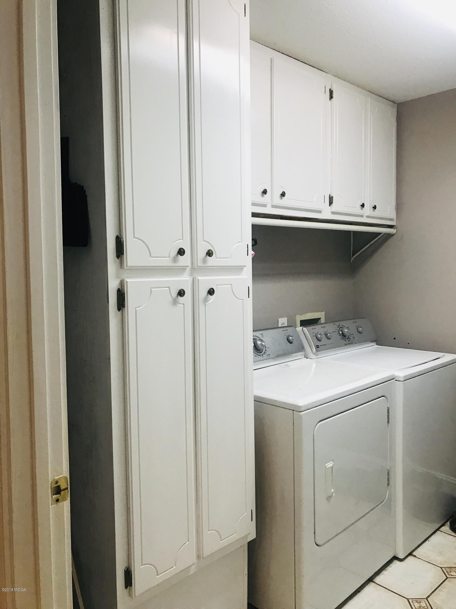 1569 Johnson Road Macon, GA 31220 - Photo 24 of 28 a view of storage and utility room with washer and dryer