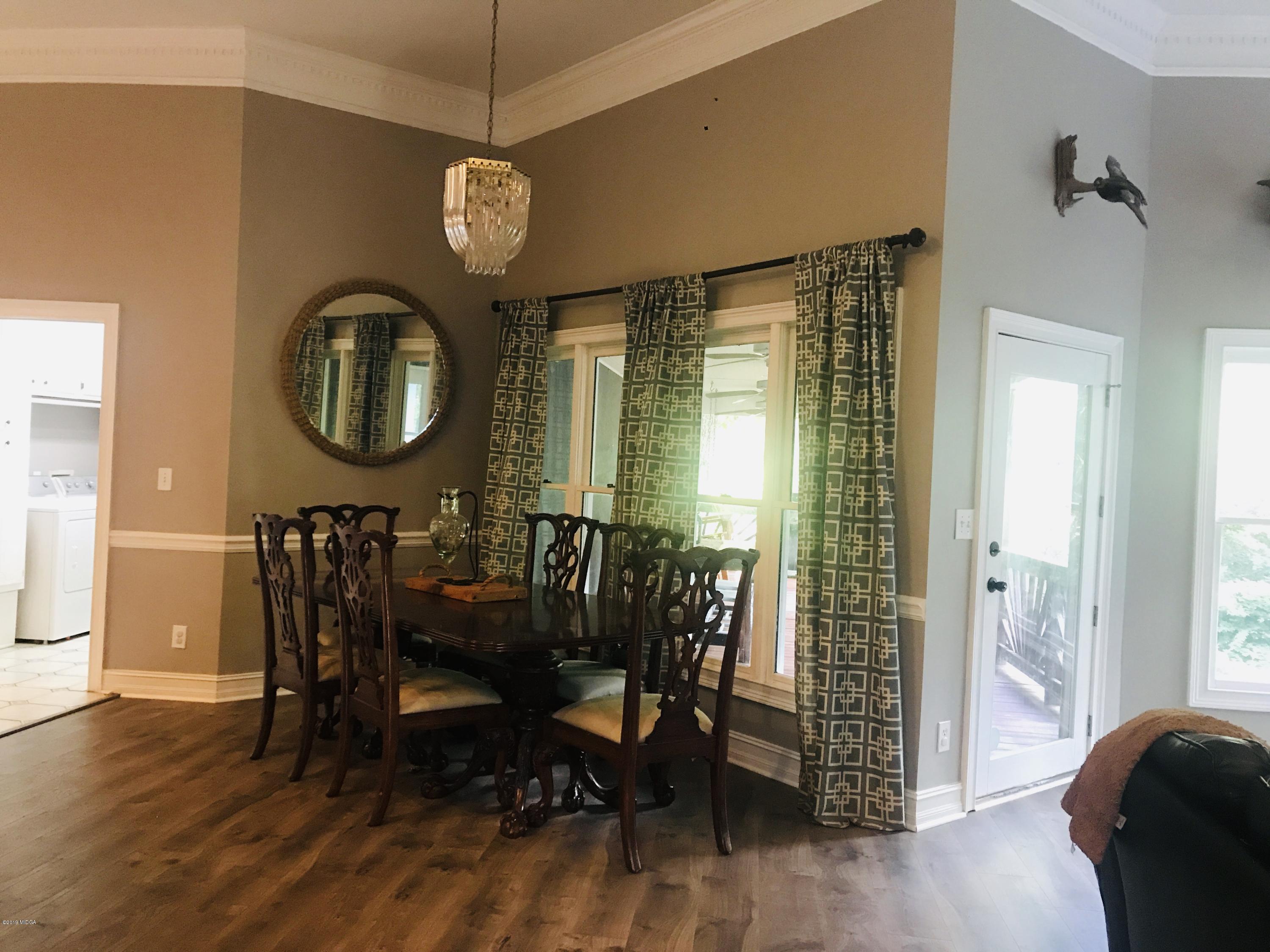 1569 Johnson Road Macon, GA 31220 - Photo 27 of 28 a view of a dining room with furniture window and wooden floor