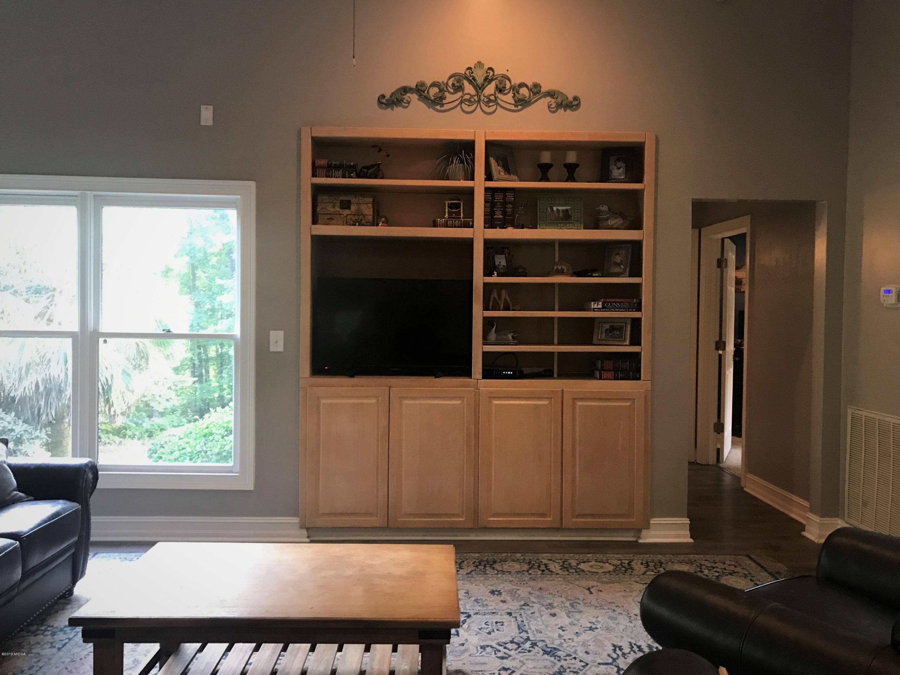1569 Johnson Road Macon, GA 31220 - Photo 6 of 28 a living room with a black furniture and a window