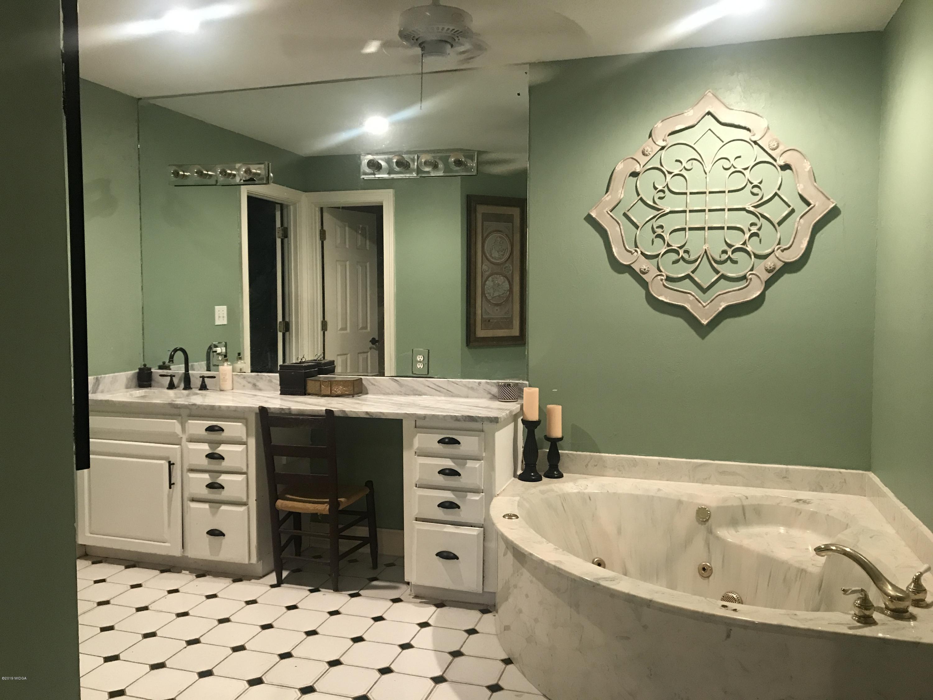 1569 Johnson Road Macon, GA 31220 - Photo 9 of 28 a bathroom with a sink and a mirror