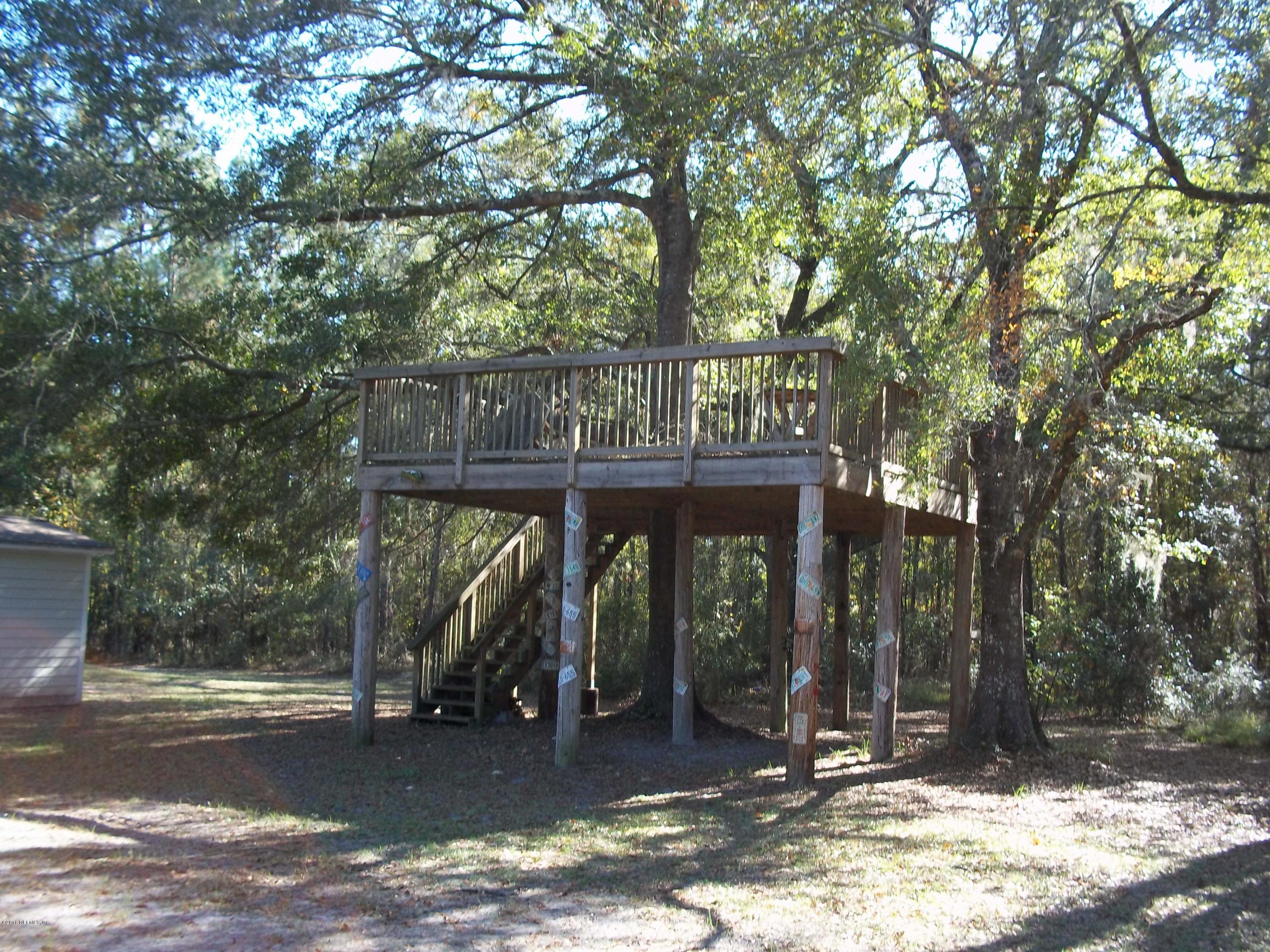 5579 Long Branch Road Jacksonville, FL 32234 - Photo 13 of 54 a front view of a house