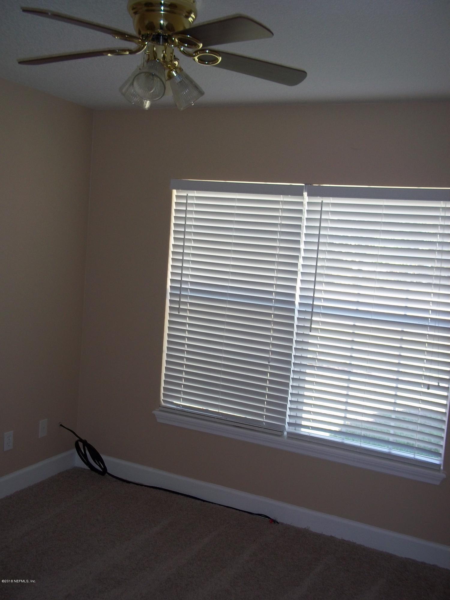 5579 Long Branch Road Jacksonville, FL 32234 - Photo 31 of 54 an empty room with a window