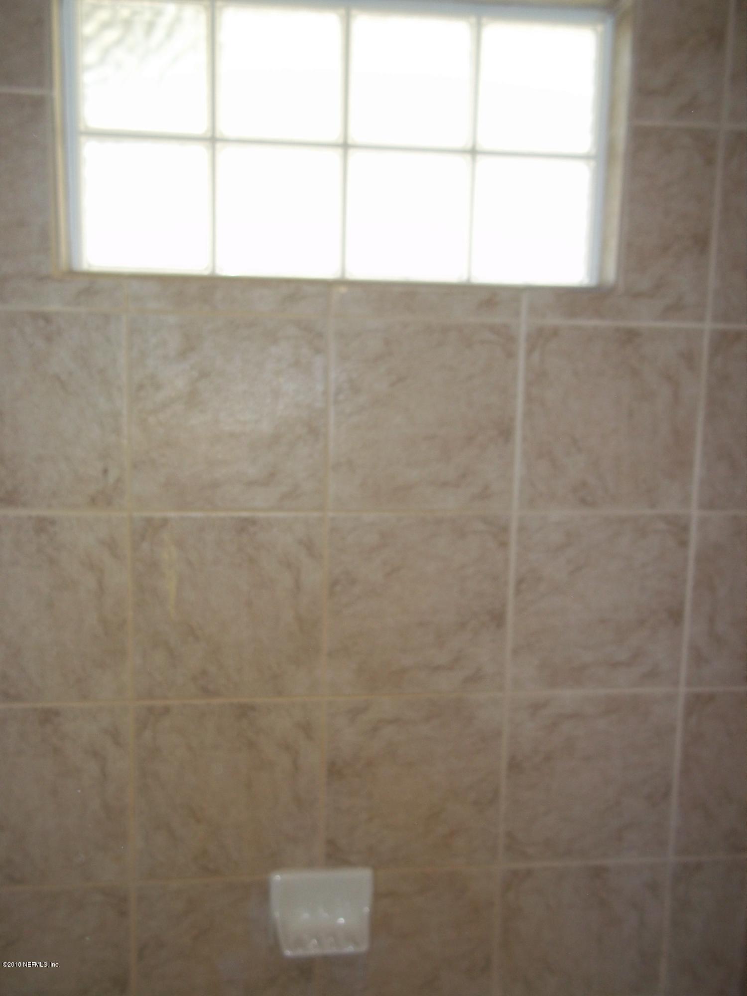 5579 Long Branch Road Jacksonville, FL 32234 - Photo 36 of 54 a bathroom with a window