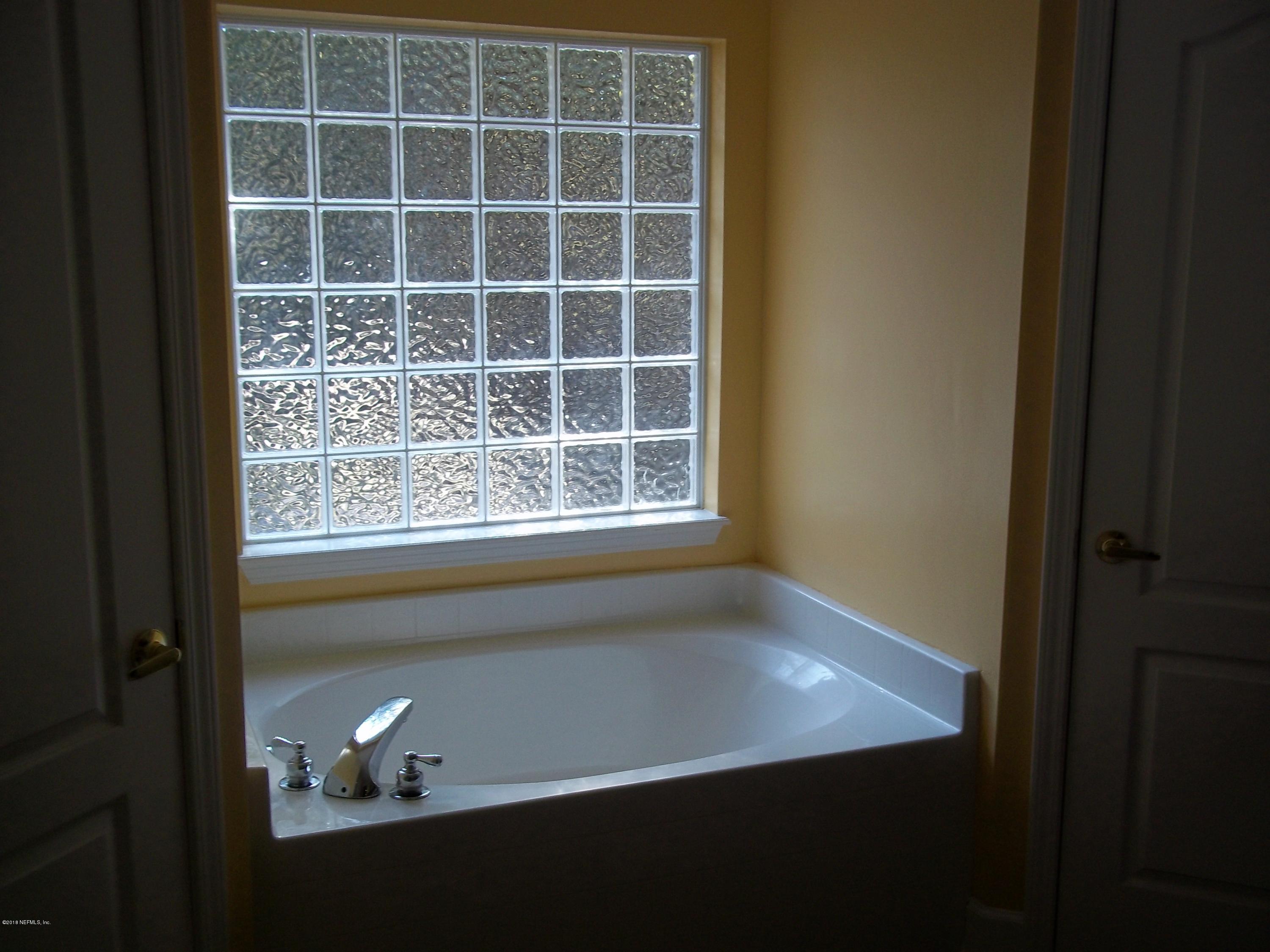 5579 Long Branch Road Jacksonville, FL 32234 - Photo 45 of 54 a view of an empty room with a window