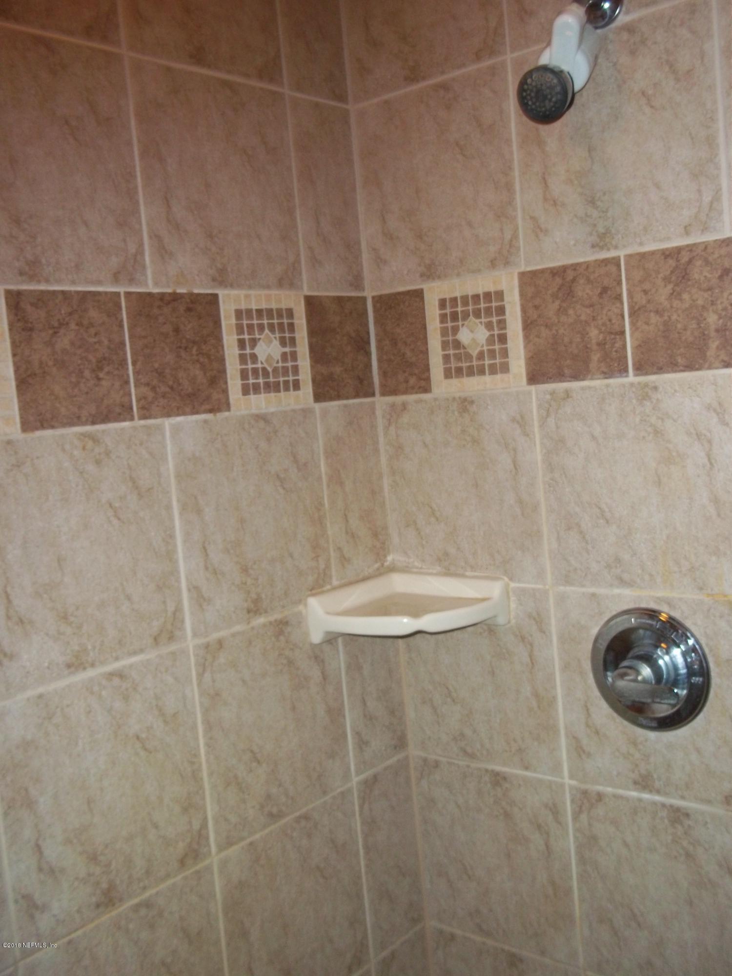 5579 Long Branch Road Jacksonville, FL 32234 - Photo 49 of 54 a bathroom with a shower