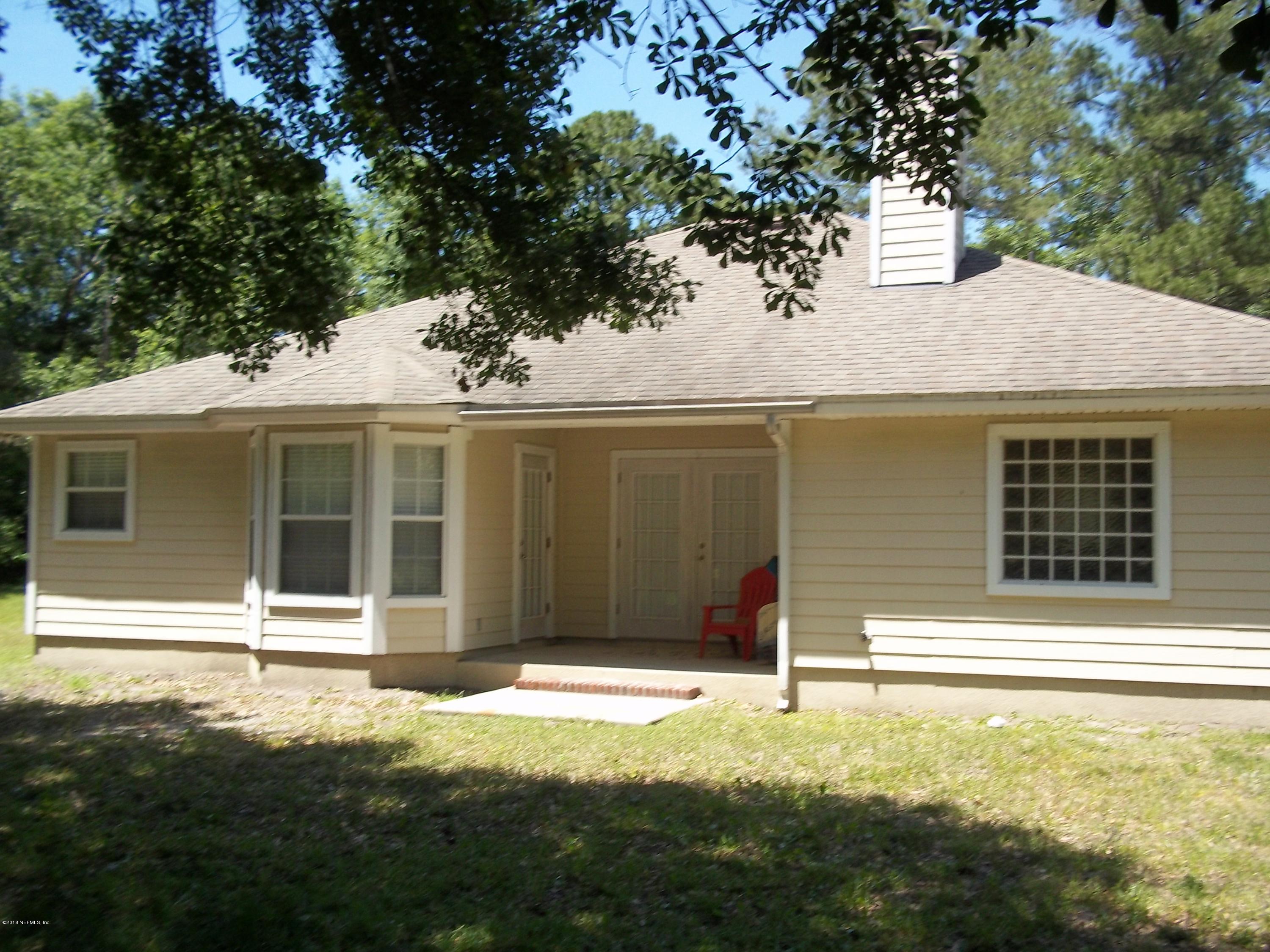 5579 Long Branch Road Jacksonville, FL 32234 - Photo 5 of 54 a house with a yard