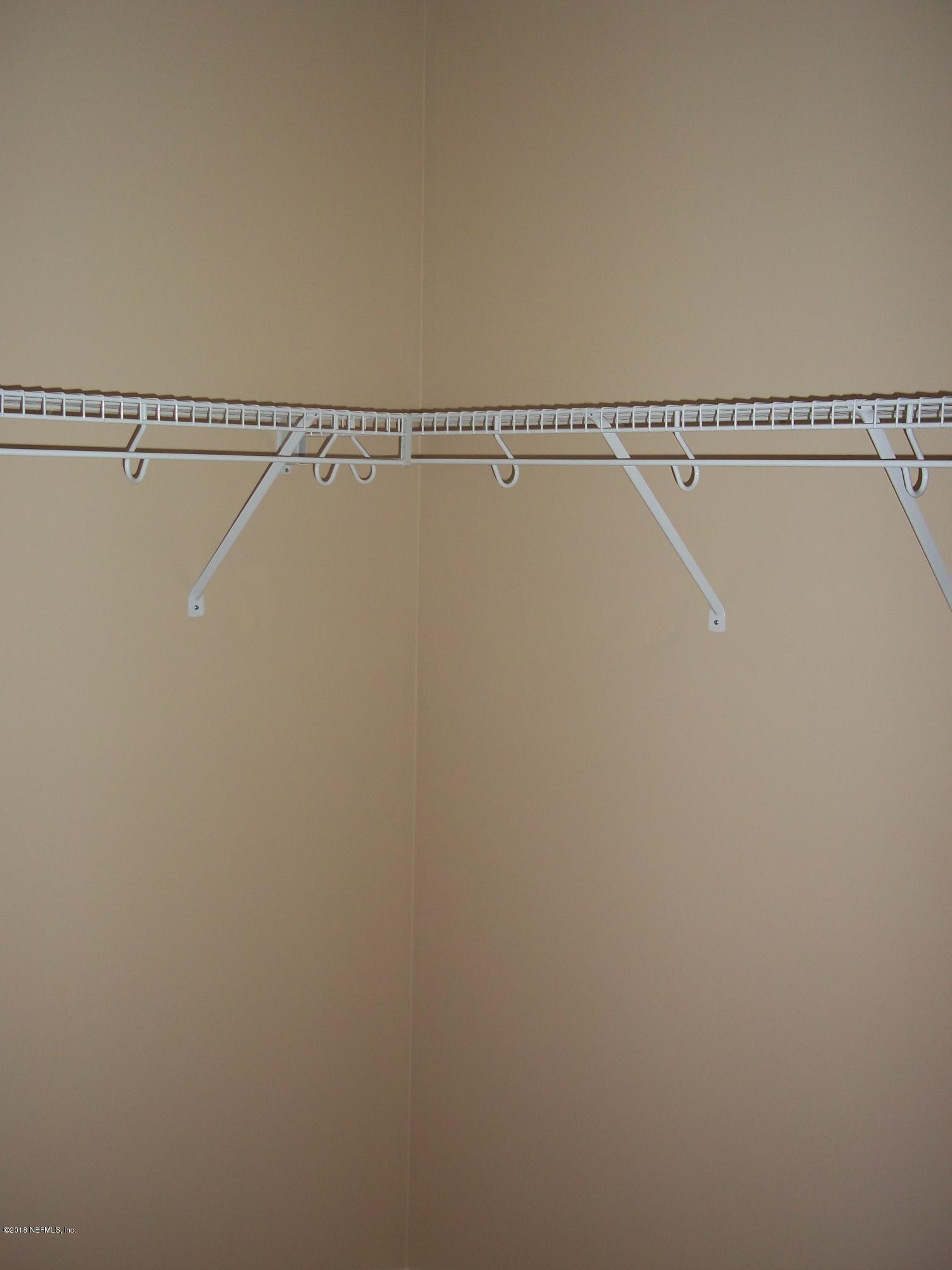 5579 Long Branch Road Jacksonville, FL 32234 - Photo 52 of 54 a view of a room with racks on the wall