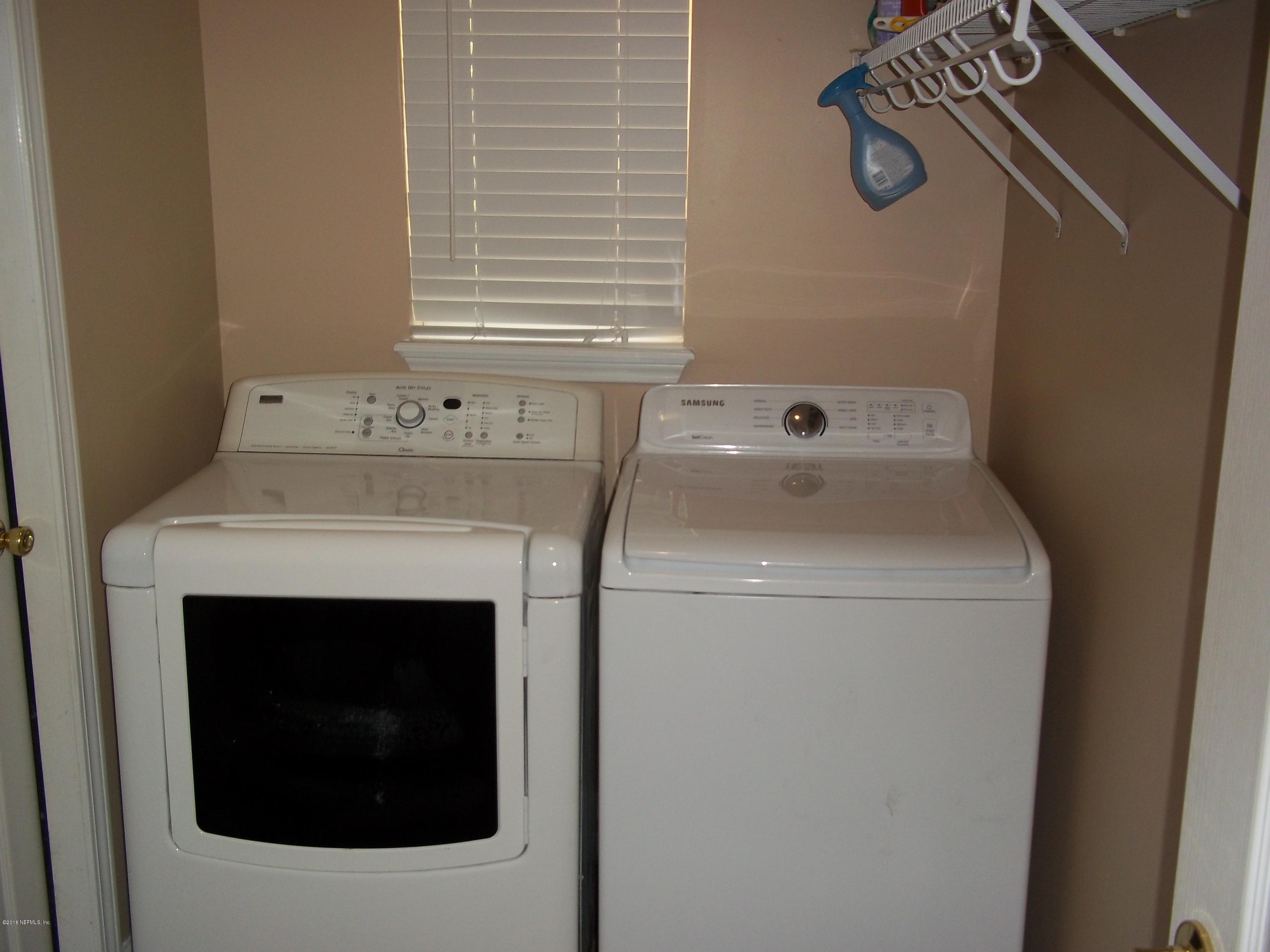 5579 Long Branch Road Jacksonville, FL 32234 - Photo 53 of 54 a utility room with dryer and washer