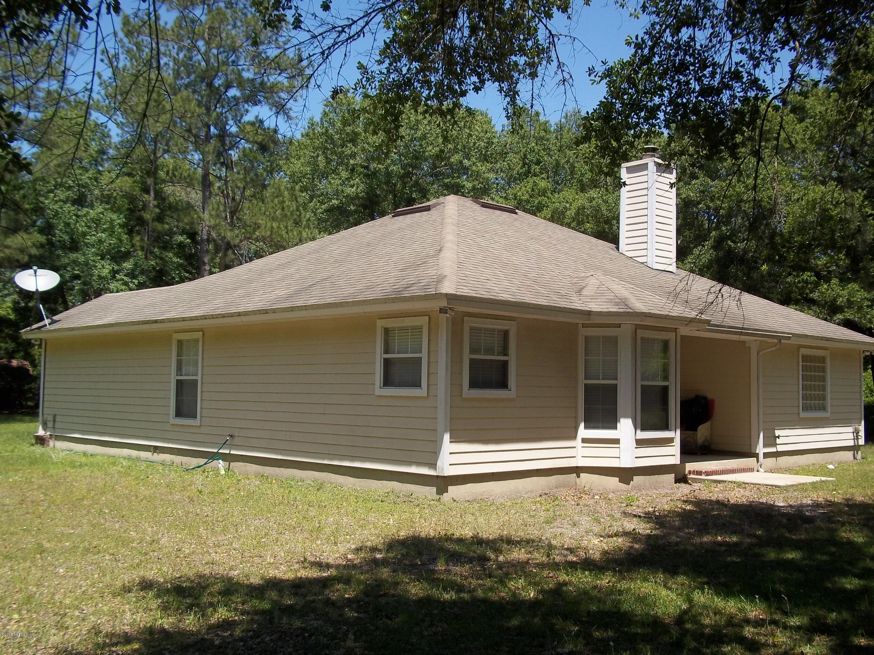 5579 Long Branch Road Jacksonville, FL 32234 - Photo 7 of 54 a backyard of a house