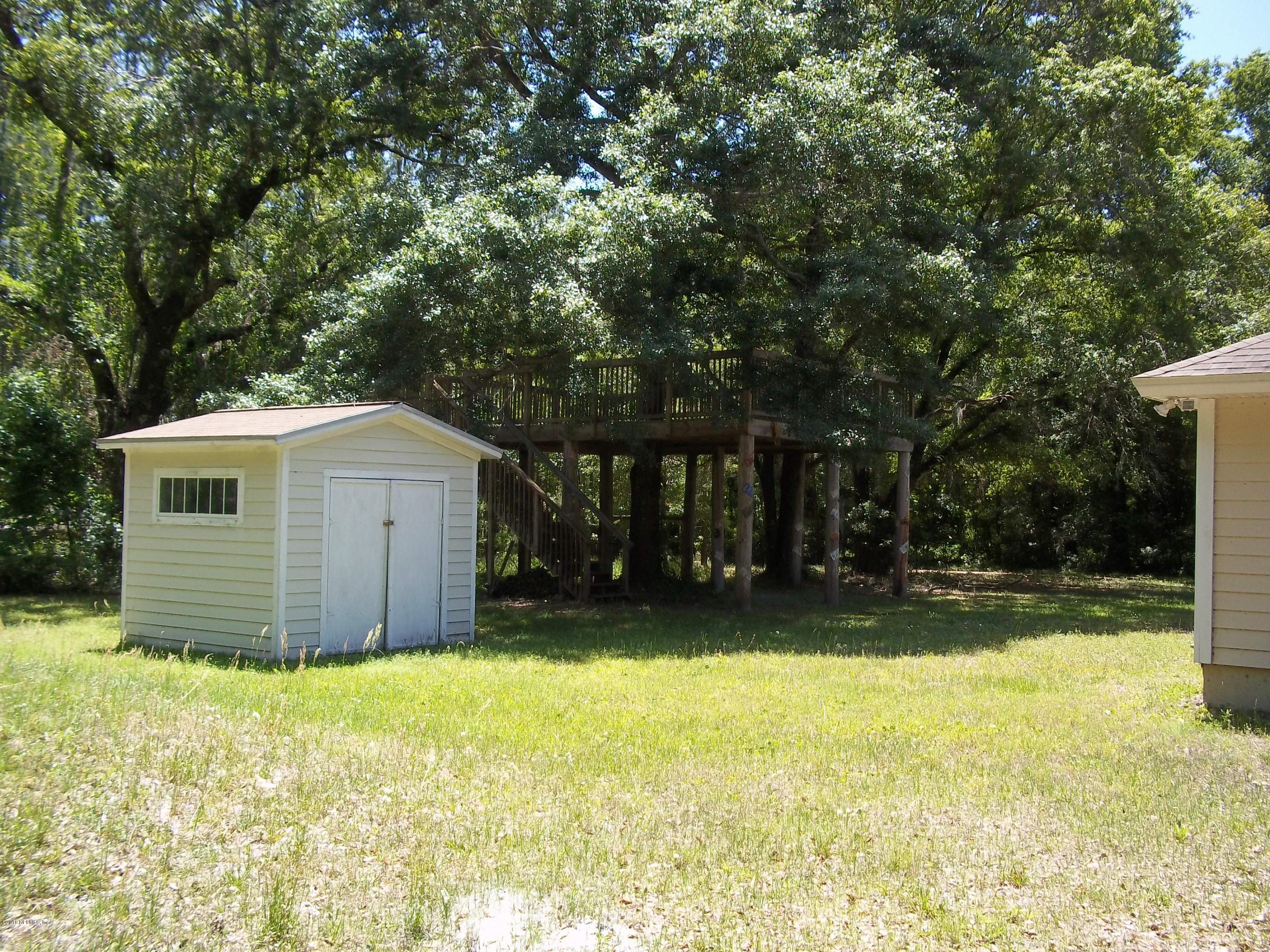 5579 Long Branch Road Jacksonville, FL 32234 - Photo 10 of 54 a view of a back yard of the house