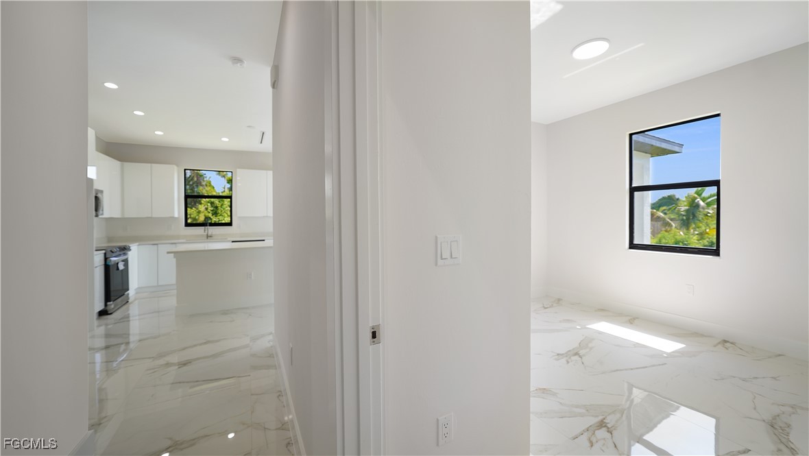 123 Ichabod Avenue Lehigh Acres, FL 33973 - Photo 27 of 42 a view of an entryway with wooden floor