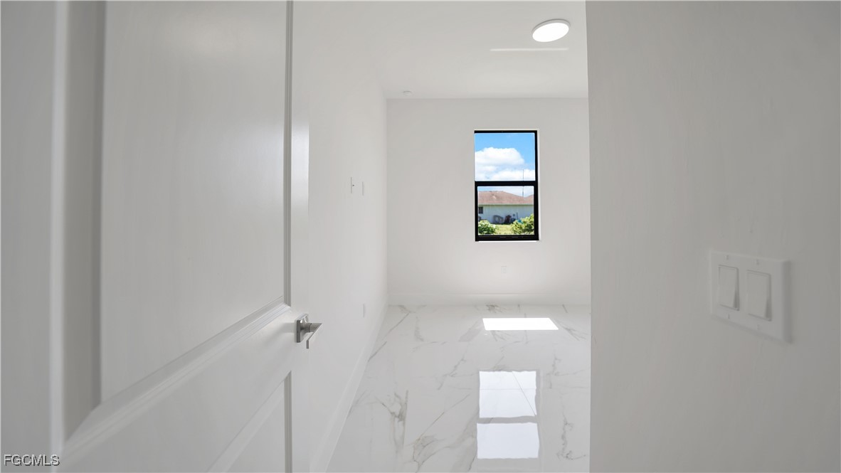 123 Ichabod Avenue Lehigh Acres, FL 33973 - Photo 31 of 42 a picture of a bathroom with a toilet and mirror