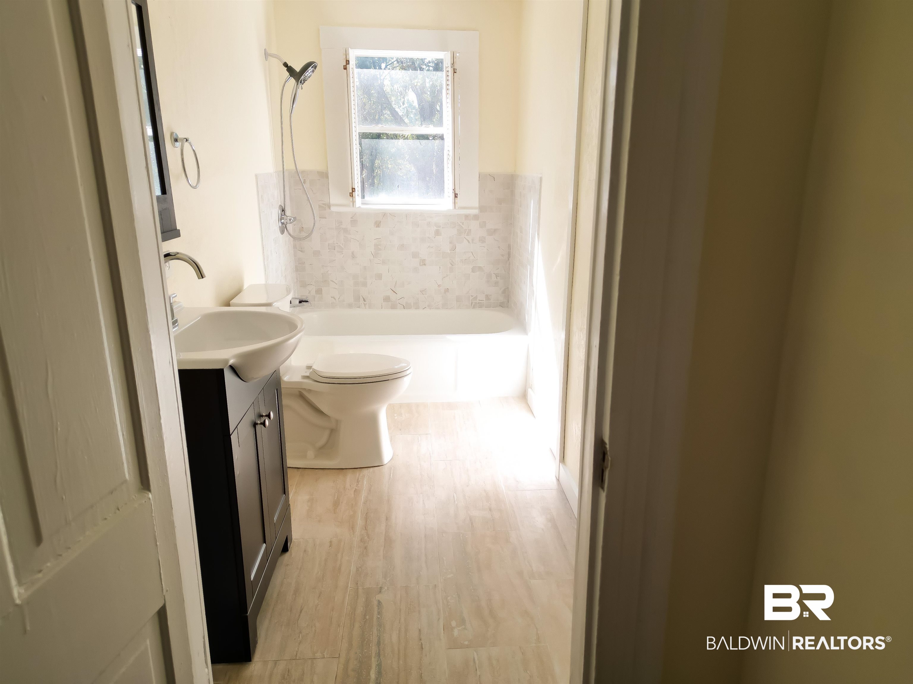 73 Liberty Street Monroeville, AL 36460 - Photo 21 of 29 Full bathroom featuring vanity, wood-type flooring, toilet, and tub / shower combination
