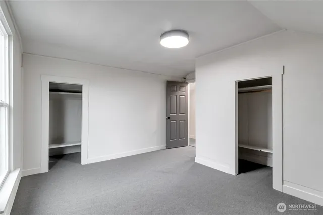 a view of an empty room and closet