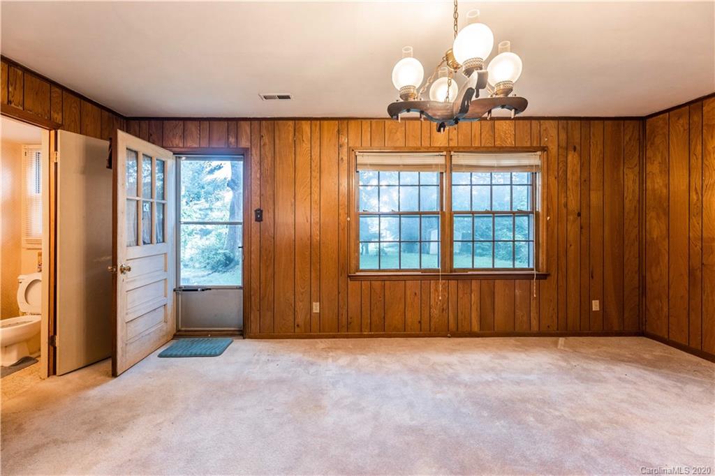7518 Riding Trail Road Charlotte, NC 28212 - Photo 14 of 36 a view of an empty room with a window