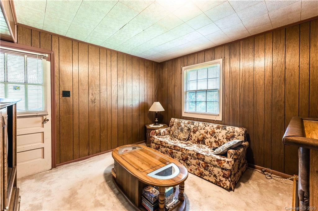 7518 Riding Trail Road Charlotte, NC 28212 - Photo 23 of 36 a living room with furniture and a window