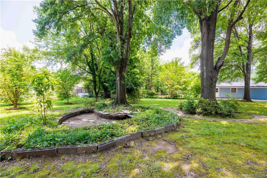 7518 Riding Trail Road Charlotte, NC 28212 - Photo 36 of 36 a view of a garden with large trees