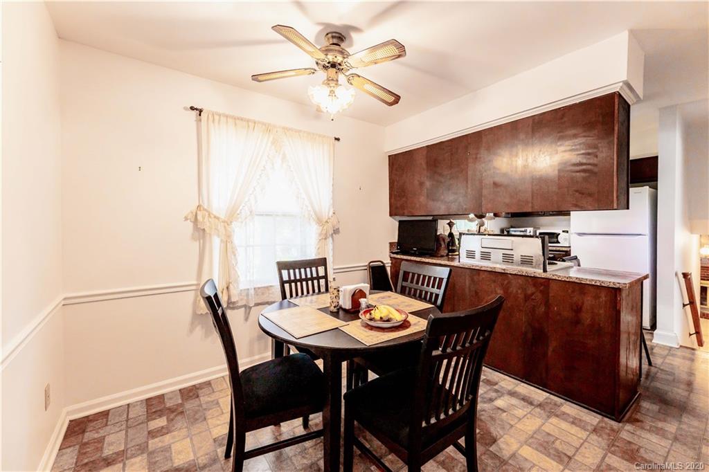 7518 Riding Trail Road Charlotte, NC 28212 - Photo 9 of 36 a view of a dining room with furniture