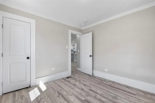 a view of wooden floor and windows in a room