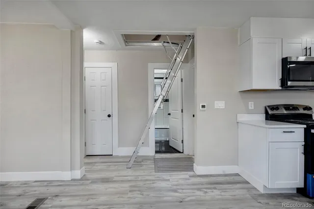 a view of a kitchen from the empty room