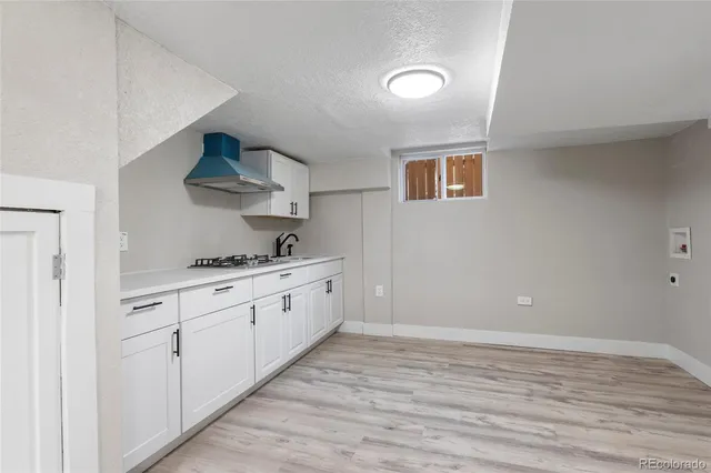 a view of a kitchen with electric appliances
