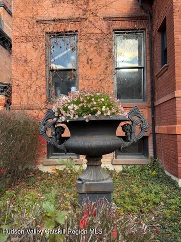 a room with water heater and wooden floor