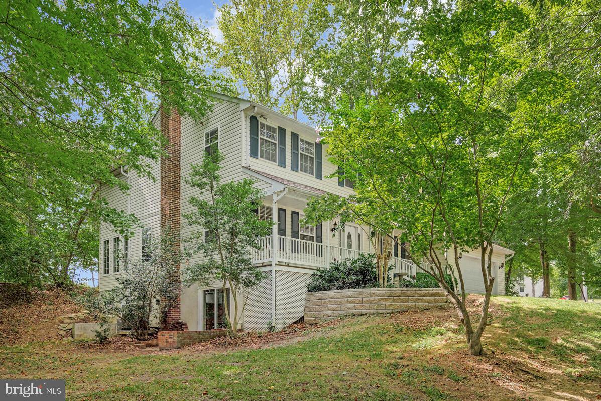 5963 Hillside Road St. Leonard, MD 20685 - Photo 3 of 54 front view of a house with a yard