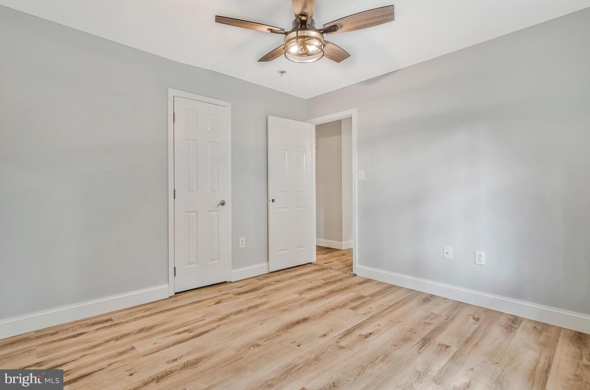 5963 Hillside Road St. Leonard, MD 20685 - Photo 33 of 54 wooden floor in an empty room