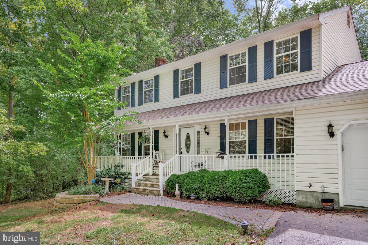 5963 Hillside Road St. Leonard, MD 20685 - Photo 4 of 54 front view of a house with a yard