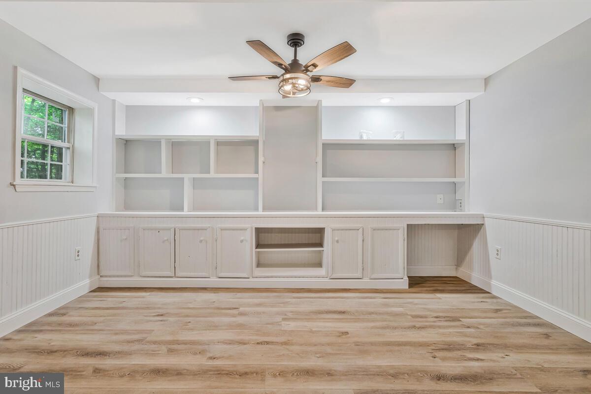 5963 Hillside Road St. Leonard, MD 20685 - Photo 42 of 54 a view of an empty room with a window