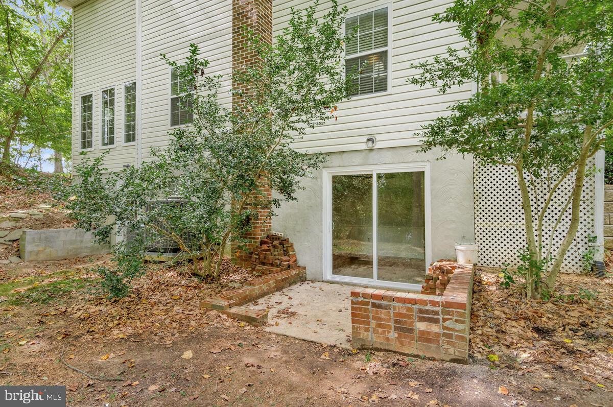 5963 Hillside Road St. Leonard, MD 20685 - Photo 46 of 54 a front view of a house with a yard