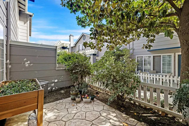 a wooden bench sitting in front of a house