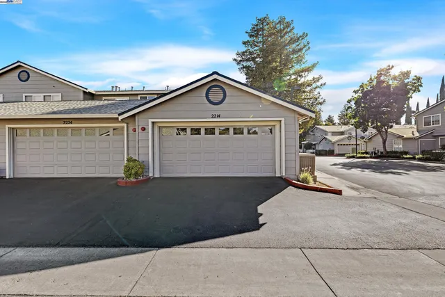 a front view of a house with a garage