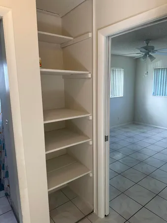 a view of an empty walk in closet