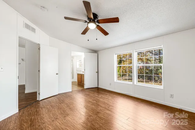 a bathroom with a sink a mirror and a shower