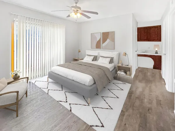 a bedroom with a bed and a television
