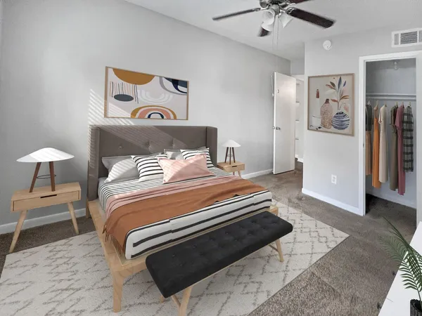 a bedroom with bed and a chandelier
