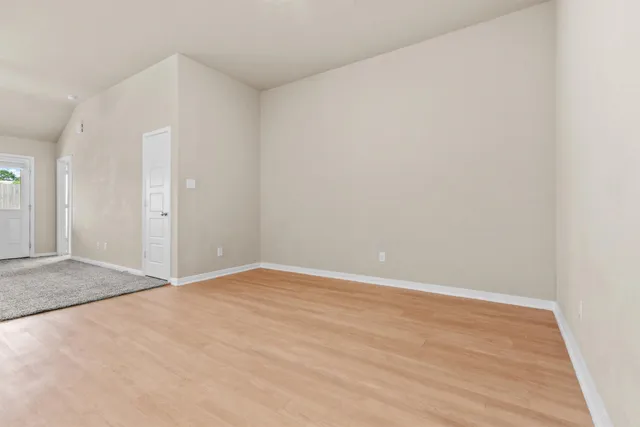 an empty room with wooden floor