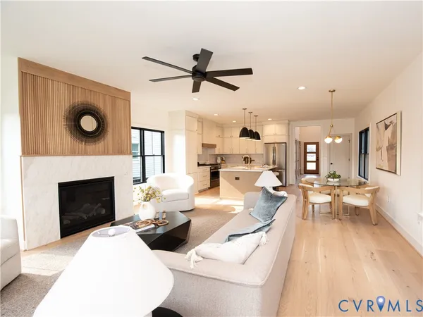a living room with furniture and a fireplace