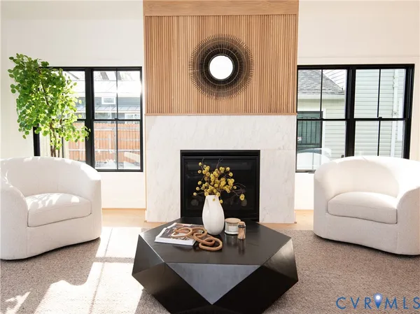 a living room with furniture and a fireplace