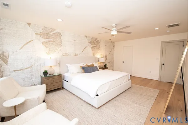 a large white bed in a white room